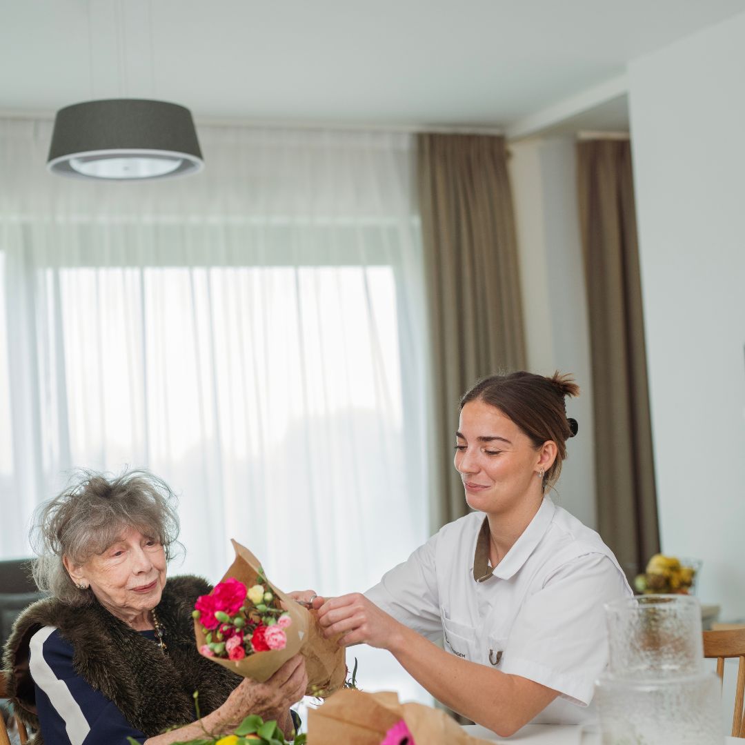 a nurse helping a lady