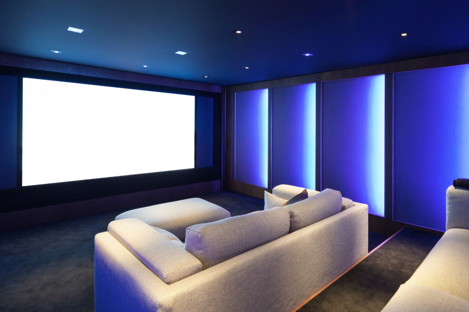 Home theater room, illuminated with Proluxe LED lighting in blue.