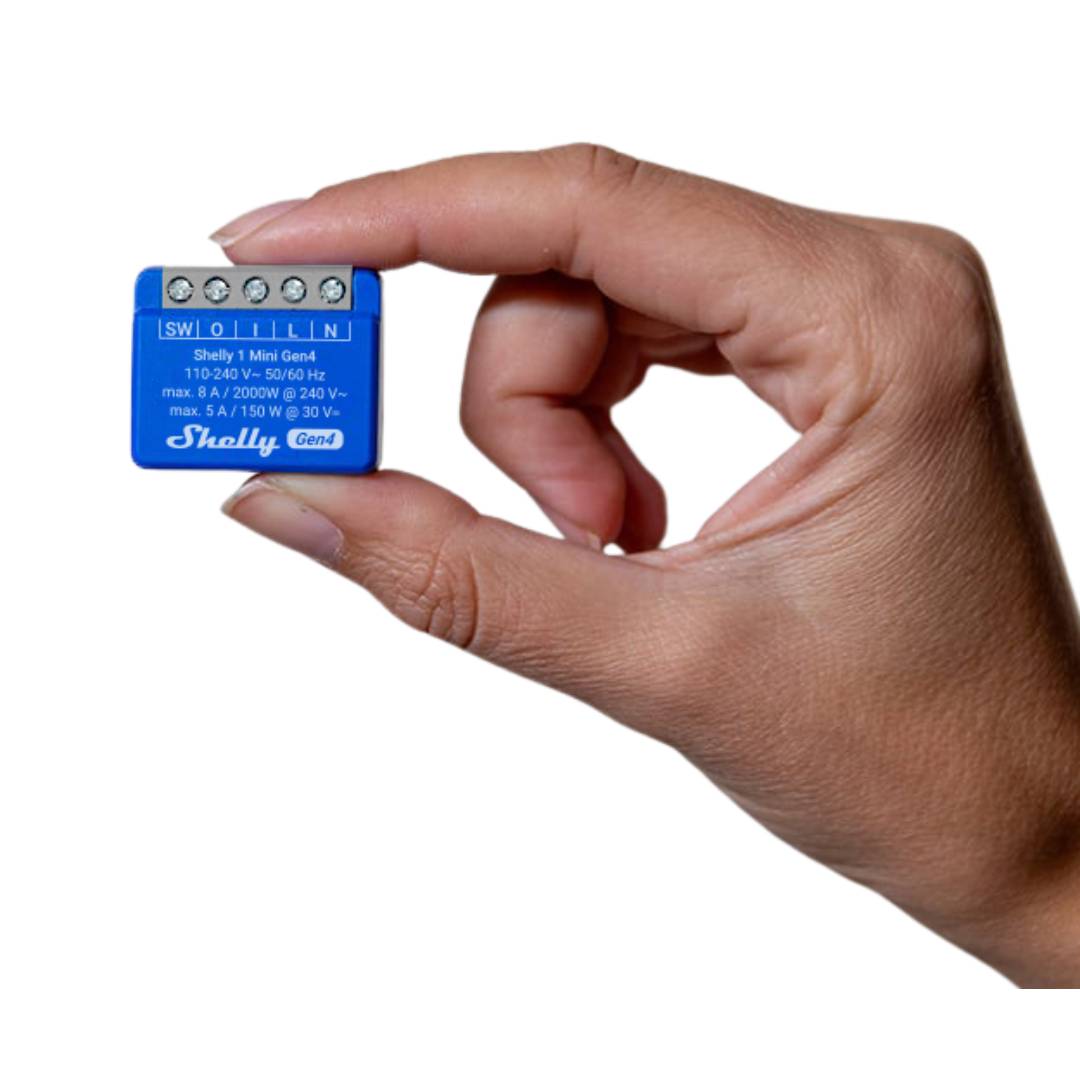 Hand holding a small blue electronic device with 'Shelly' branding on a white background