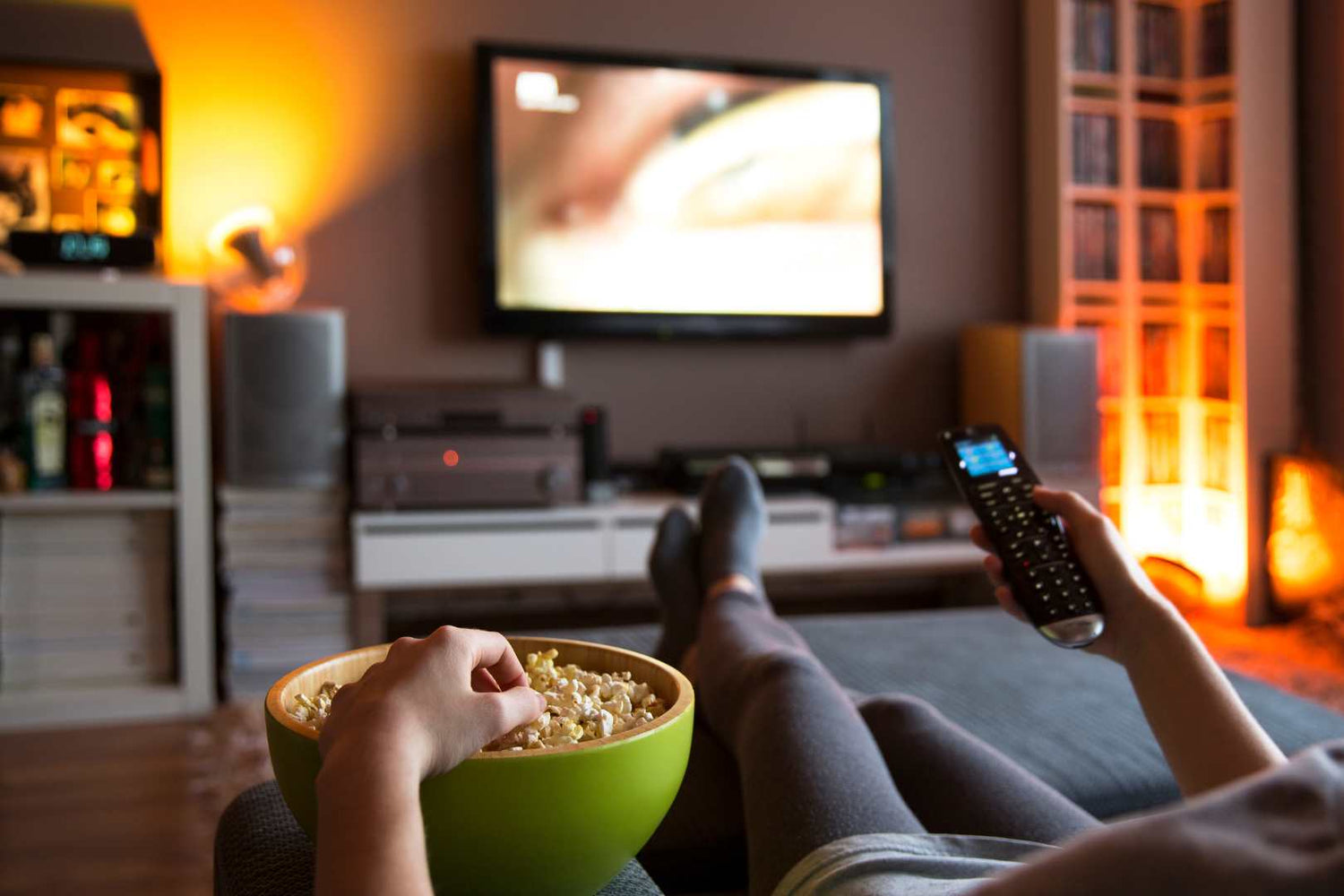 Person on sofa watching a movie