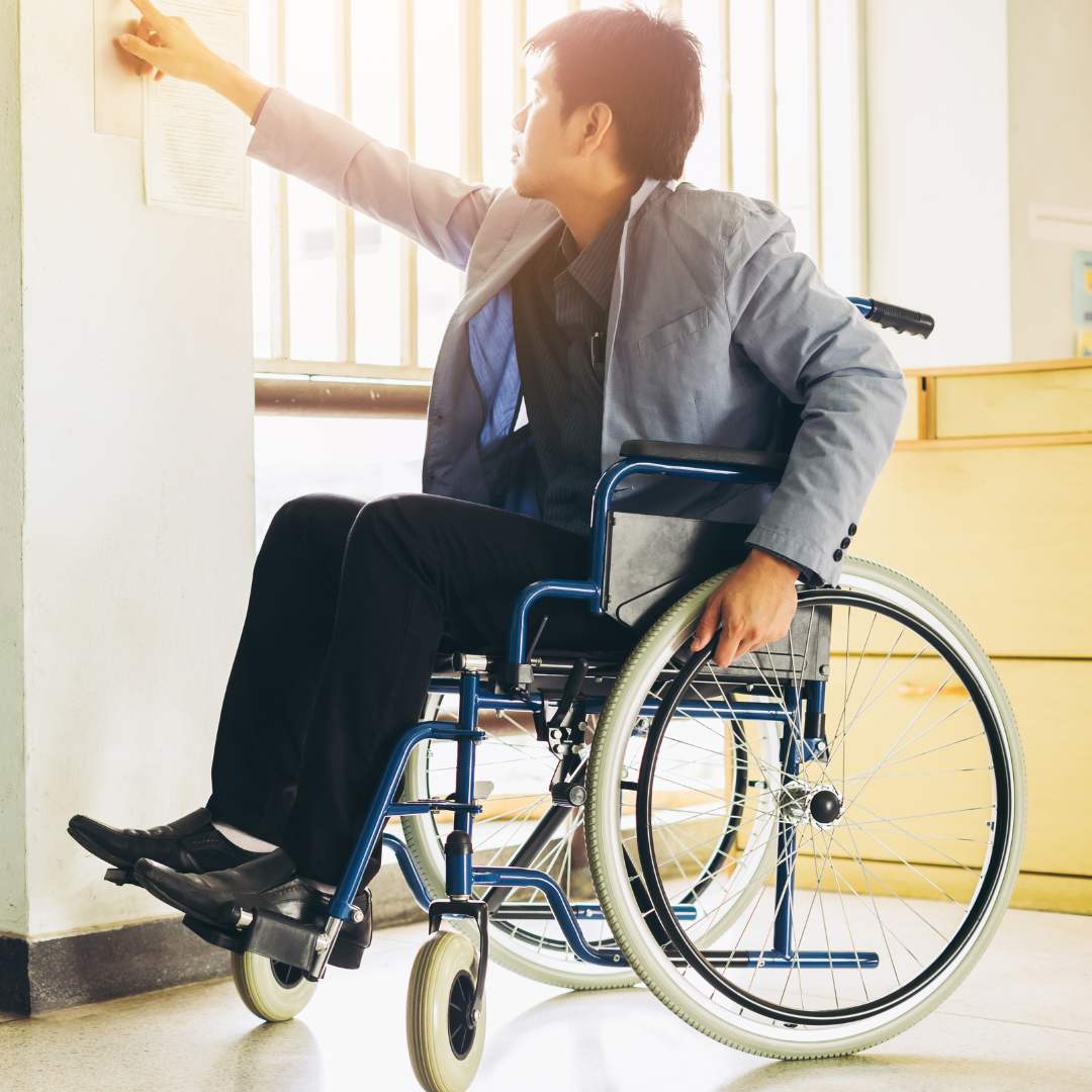 person in a wheelchair turning on a light