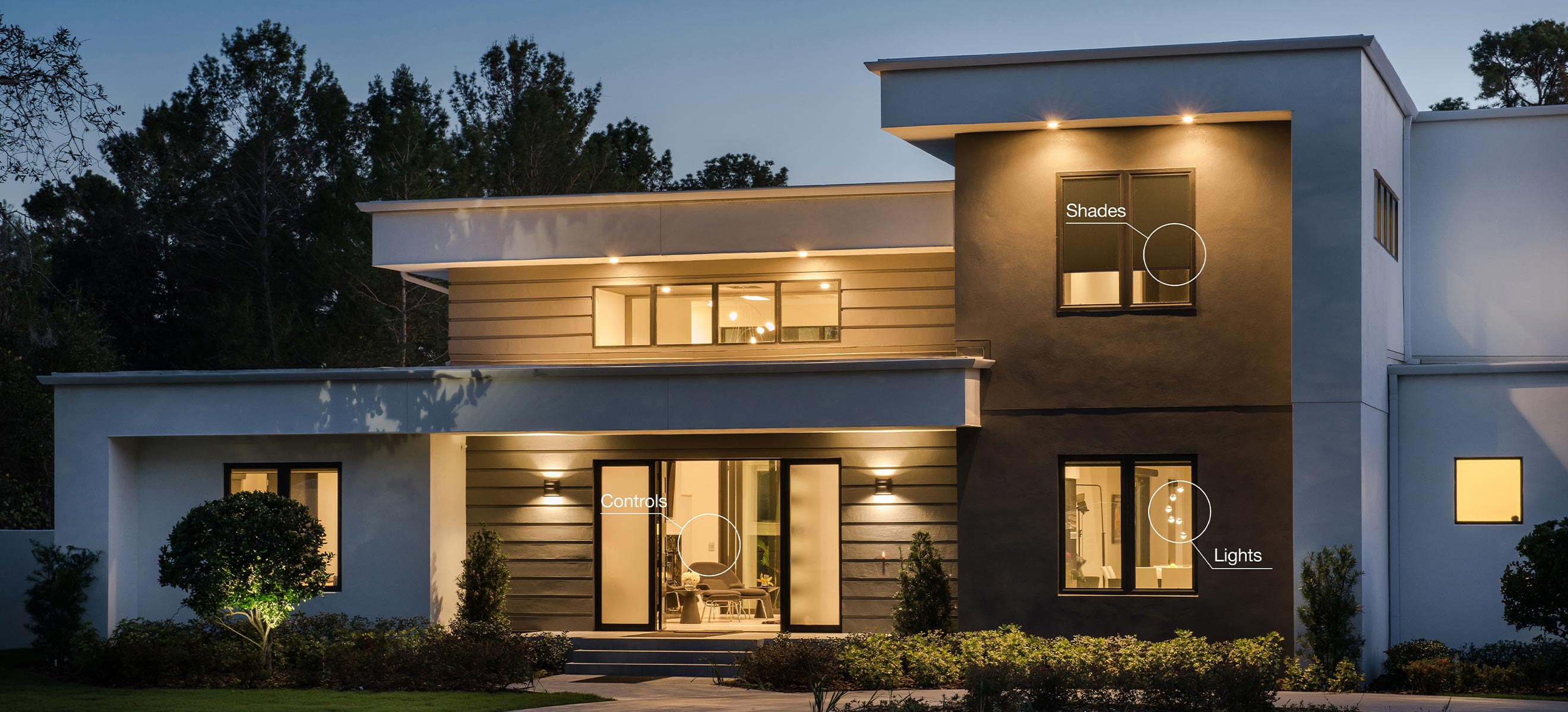 Front view of a house with automated lights and curtains